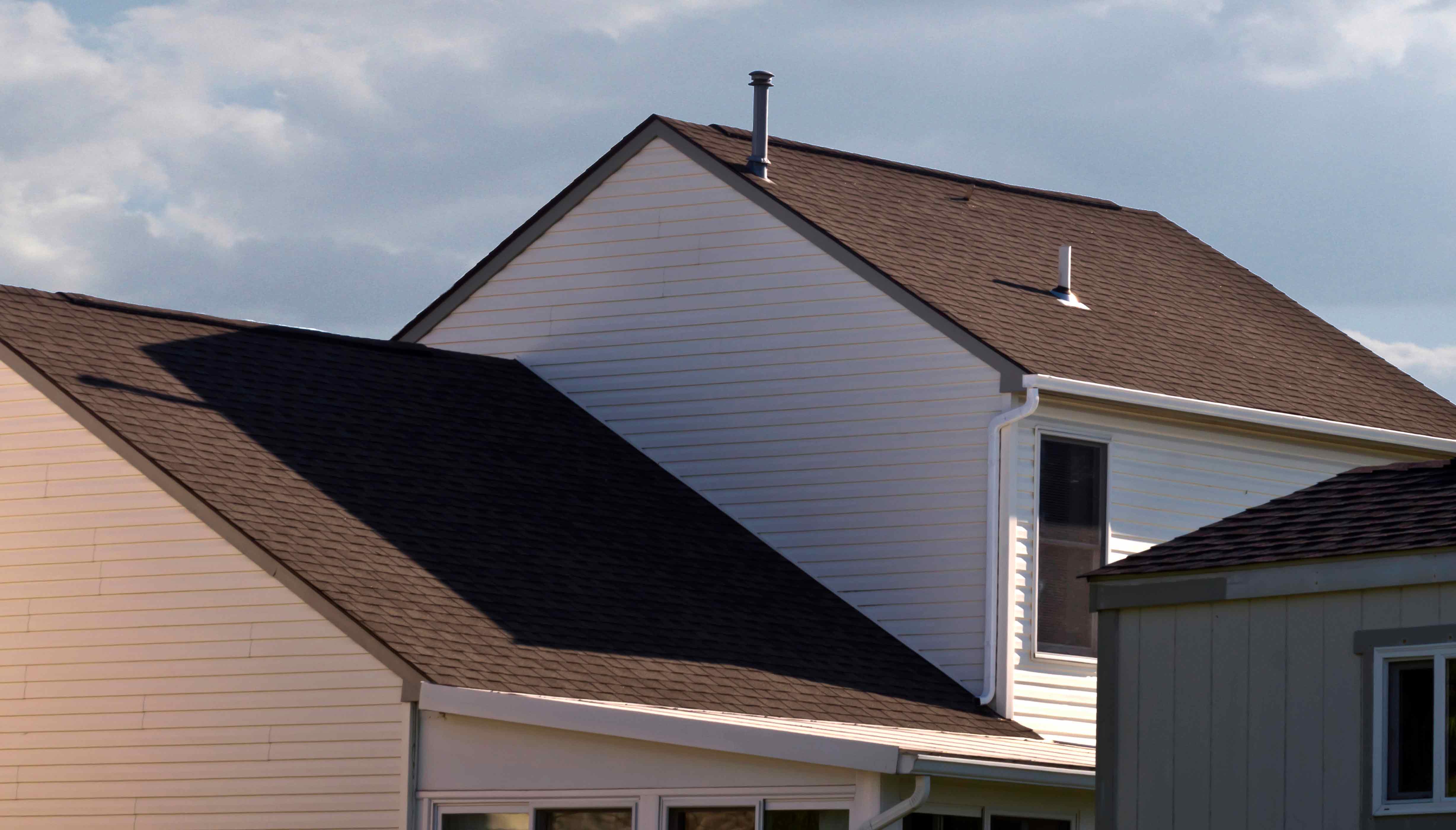 large house with siding and gutters